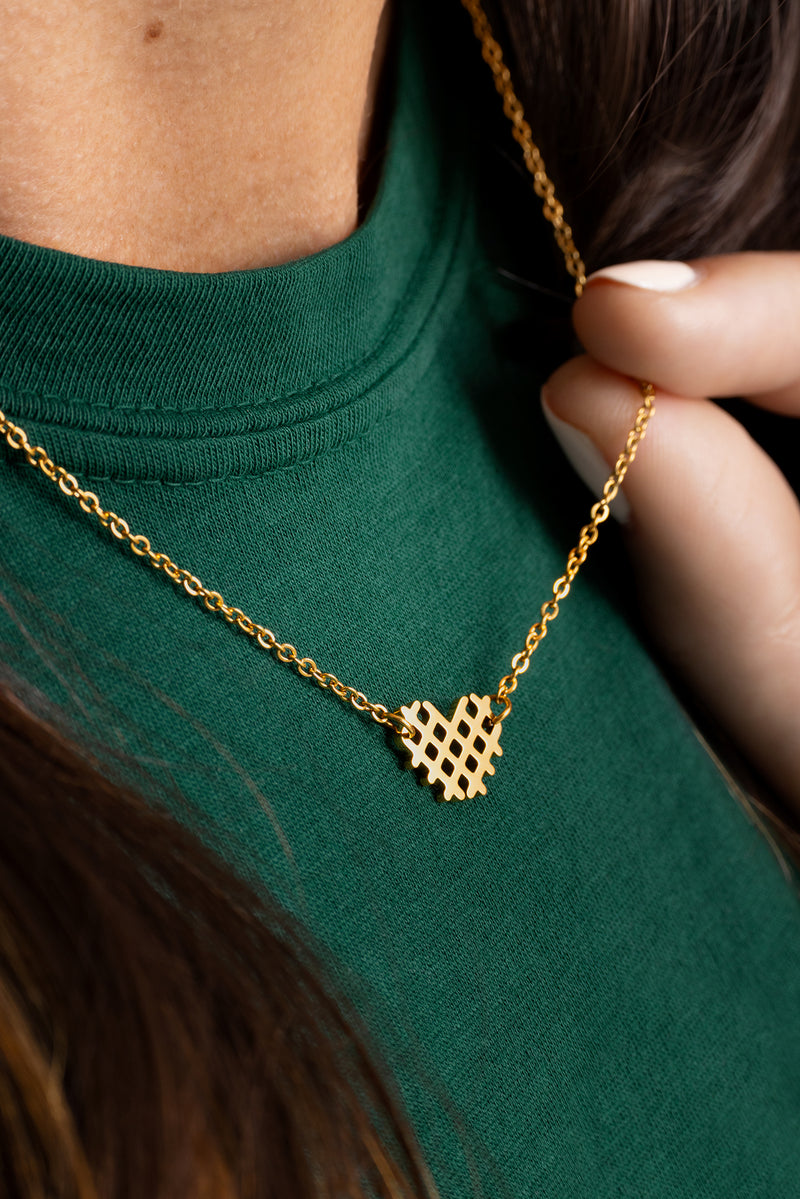 4-CFA_IHA_311050_HOL25_Merch_Waffle-Fry-Necklace_Talent_On-white_1.jpg